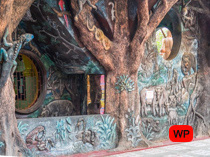 Wood mural depicting forest.